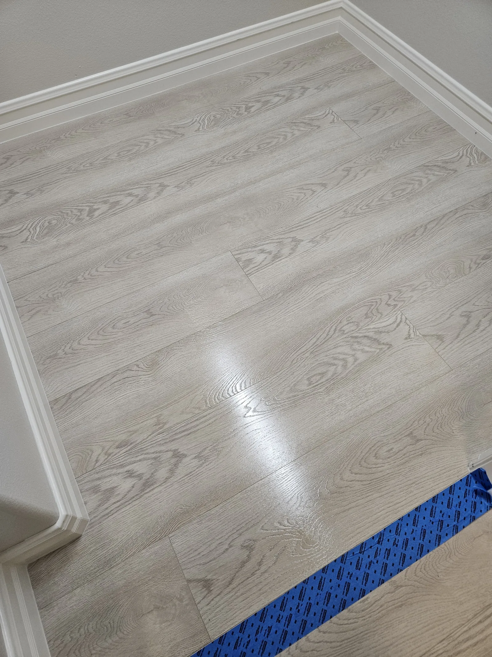 Finished pale wood-look plank floor at the Las Vegas project site