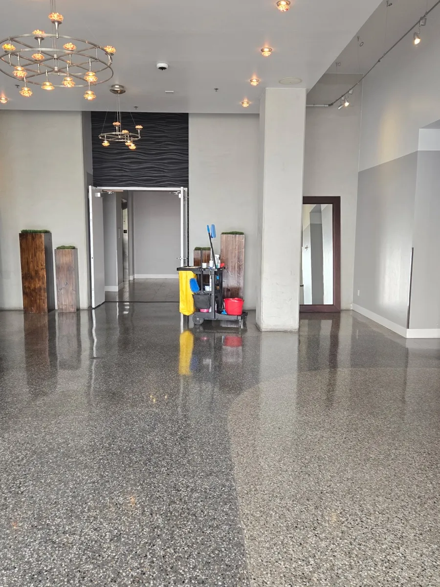 Janitorial cart in a polished school or campus corridor