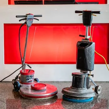 Commercial floor buffers used for hard floor restoration in a lobby